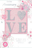 This softly glowing anniversary card offers a quiet celebration of enduring romance, its design echoing the calm charm of Collier Row's neighbourhood streets on a peaceful evening. The focal point is the word LOVE, formed from soft, raised lettering dusted with fine glitter that sparkles just enough to catch the eye. The letter O is transformed into a shimmering silver heart, adding a touch of intimacy and symbolism, as if the heart itself completes the word. Surrounding this centrepiece, delicate blooms in blush pinks and muted mauves unfurl with a gentle, almost watercolour softness, their contours defined by fine, flowing lines. The effect suggests petals opening gradually, much like flowers in a carefully timed anniversary bouquet. Slender swirls, trailing petals, and understated butterflies weave in and out of the blossoms, adding a sense of motion and lighthearted whimsy comparable to petals drifting along the pavements near Collier Row's local shops. The colour palette is composed of pastel pinks, soft whites, and silvery greys, creating an atmosphere of cherished intimacy rather than bold celebration. Along the top and bottom, graceful script phrases such as On Our Anniversary and I love you today and always appear in elegant, looping handwriting, their curves harmonising with the florals and reinforcing the heartfelt tone. The card's surface alternates between smooth cardstock and lightly textured glitter, providing a subtle tactile contrast when held. Overall, this design feels like a whispered promise captured on paper-gentle, sincere, and enduring-perfect for honouring the shared journey of a couple in Collier Row who value both romance and quiet, everyday devotion.